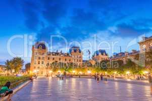 PARIS - JUNE 21, 2014: Tourists enjoy summer night lights in the
