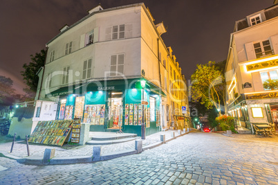 PARIS, FRANCE - JUNE 20, 2014: Tourists enjoy Montmartre city li