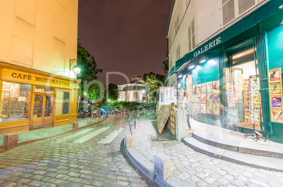 PARIS, FRANCE - JUNE 20, 2014: Tourists enjoy Montmartre city li