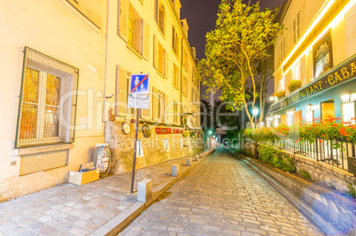 PARIS, FRANCE - JUNE 20, 2014: Tourists enjoy Montmartre city li