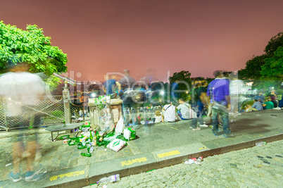 PARIS - JUNE 19, 2014: Tourists enjoy the steps of Montmartre at