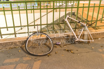 Abandoned wreck of bike in city streets