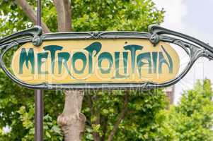 Metropolitain sign in Paris against trees