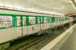PARIS - JULY 21, 2014: Metro train speeds up in subway station.