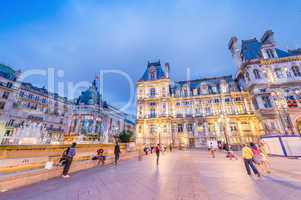 PARIS, FRANCE - JUNE 20, 2014: Tourists enjoy Hotel de Ville vie