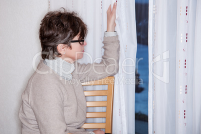 Woman looking out the window
