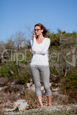 beautiful woman relax in summer outdoor in wind dune beach