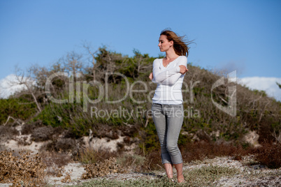 beautiful woman relax in summer outdoor in wind dune beach