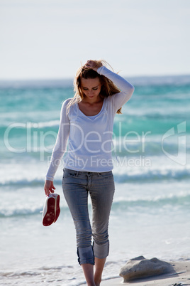 beautiful young woman relaxing at beach in summer