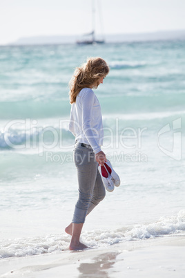 beautiful young woman relaxing at beach in summer