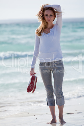 beautiful young woman relaxing at beach in summer