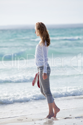 beautiful young woman relaxing at beach in summer