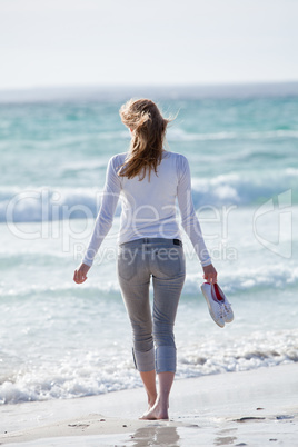 beautiful young woman relaxing at beach in summer