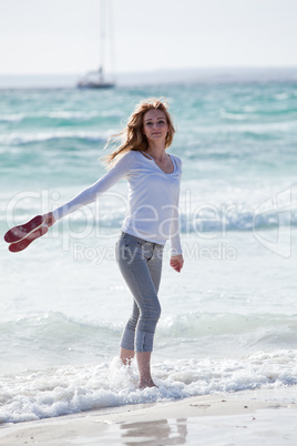 beautiful young woman relaxing at beach in summer