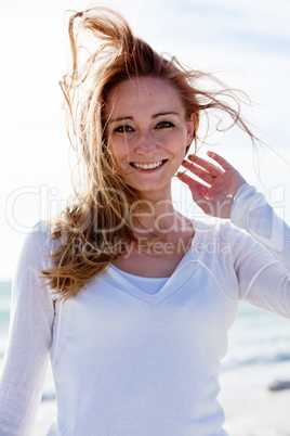 beautiful young woman relaxing at beach in summer