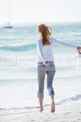 beautiful young woman relaxing at beach in summer