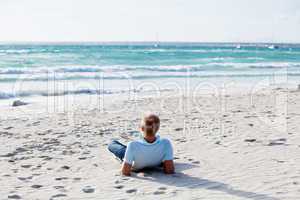 young man is relaxing on beach in summer vacation