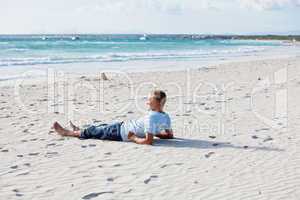 young man is relaxing on beach in summer vacation