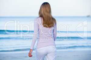 attractive young blonde woman relaxing on the beach