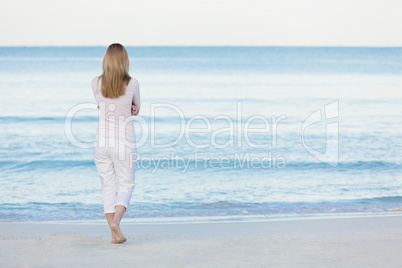 beautiful blonde woman alone at the beach