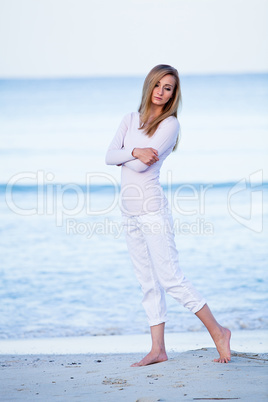 attractive young blonde woman relaxing on the beach