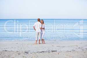 happy couple in love having fun on the beach