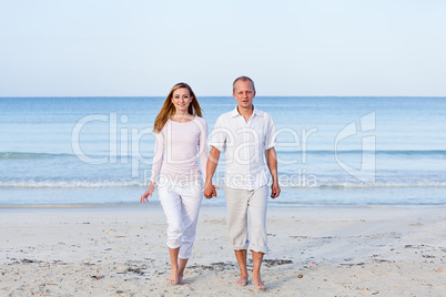 happy couple in love having fun on the beach