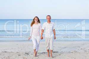 happy couple in love having fun on the beach