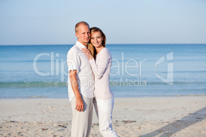 happy couple in love having fun on the beach