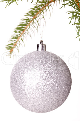 Christmas ball hanging from a branch of a fir tree