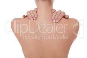 Woman caressing her bare shoulder and back