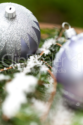 Silver Christmas ornaments in leaves