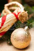 Gold Christmas ornament on leaves