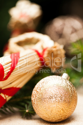 Gold Christmas ornament on leaves