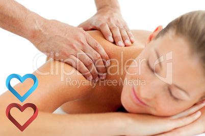 Composite image of serene woman enjoying a massage