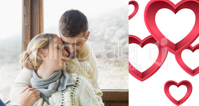 Composite image of close up of a loving young couple in winter c