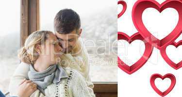 Composite image of close up of a loving young couple in winter c