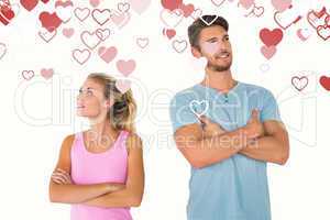 Composite image of young couple posing with arms crossed