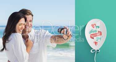 Composite image of happy couple taking a photo