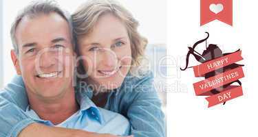 Composite image of smiling woman hugging her husband on the couc