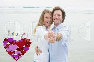 Composite image of portrait of cheerful couple dancing at beach