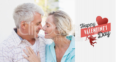 Composite image of happy mature couple sitting on bench in the c