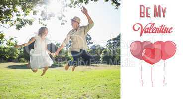 Composite image of cute couple jumping in the park together hold