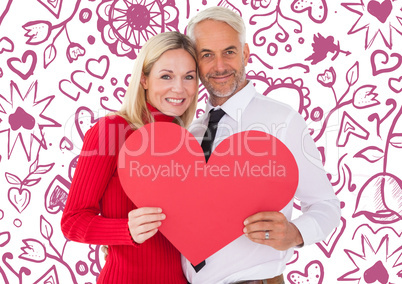 Composite image of handsome man getting a heart card form wife