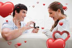 Composite image of man making a proposal to his girlfriend