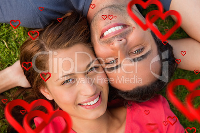 Composite image of close up of two friends looking upwards while