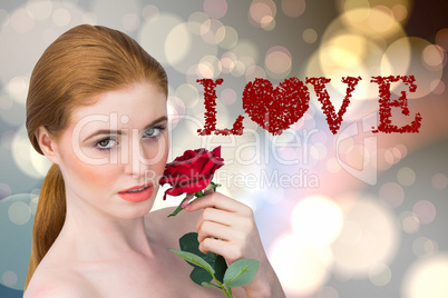 Composite image of beautiful redhead posing with red rose