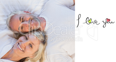 Composite image of high angle portrait of a mature couple lying