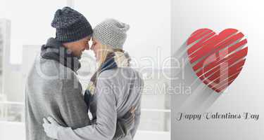 Composite image of cute couple in warm clothing hugging