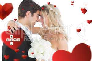 Composite image of beautiful young married couple looking each o